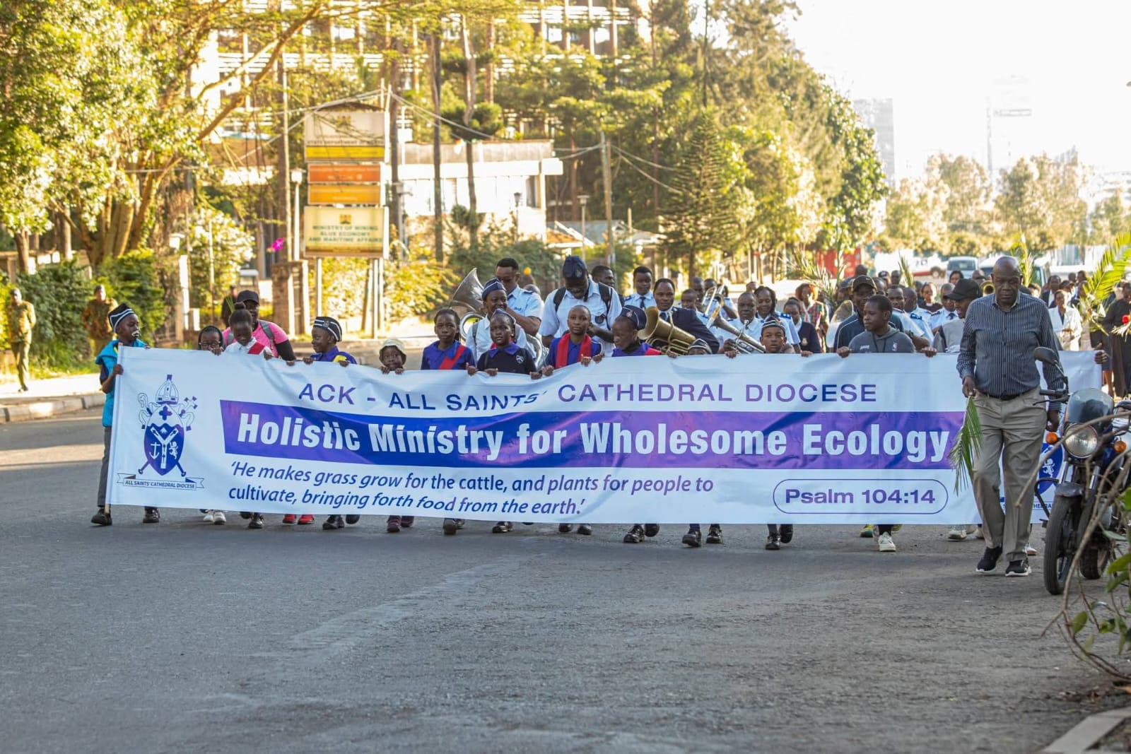 Anglican church of Kenya faithful participating in the annual walk on Palm Sunday, highlighting environmental stewardship and sustainable food productionl 