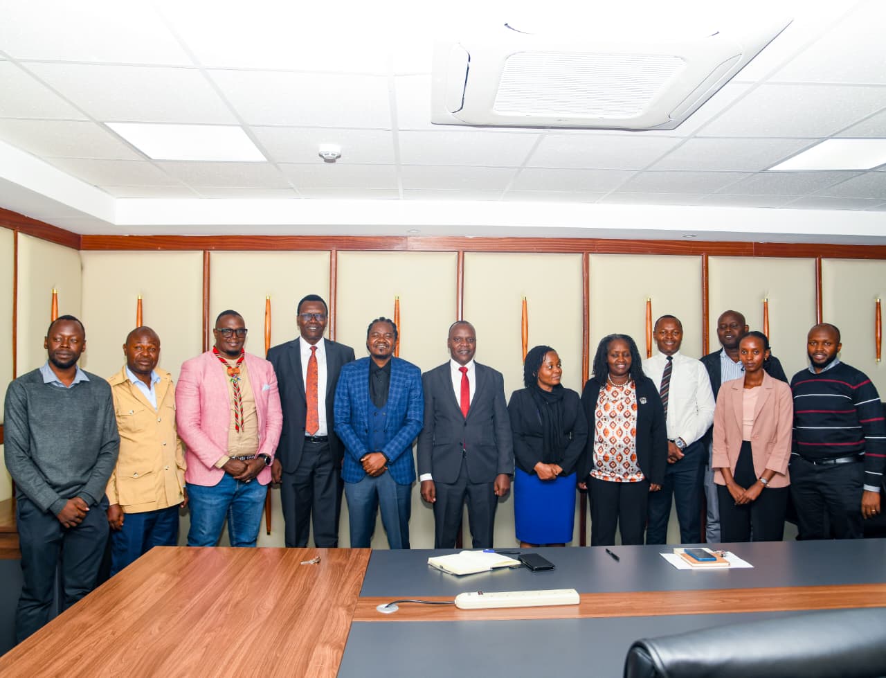 Forest Developement Secretary Mr. George Taurus and renowned Kenyan rapper and pioneer of the Genge music genre, Mr. Paul Julius Nunda (Jua Cali) and other officials during consultative meeting on the youth involvement in strengthening the 15Billion programme